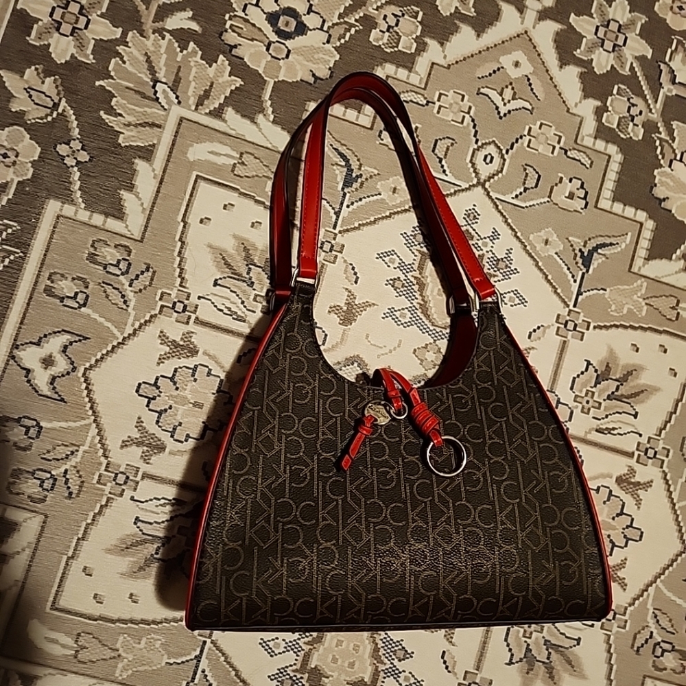 Calvin Klein NWOT shoulder monogram red/brown bag with logo charm,inside pockets